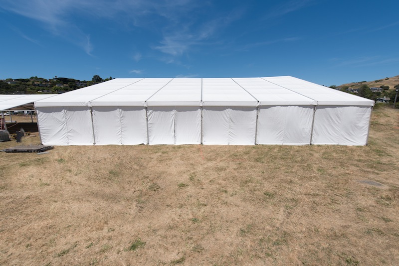 Large white tent for entertaining in field
