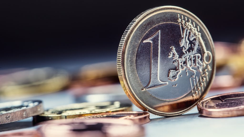 One euro coin on the edge. Euro money currency. Euro coins stacked on each other in different positions
